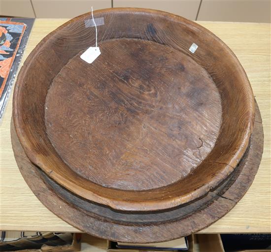 Two large hardwood circular trays largest diameter 60cm